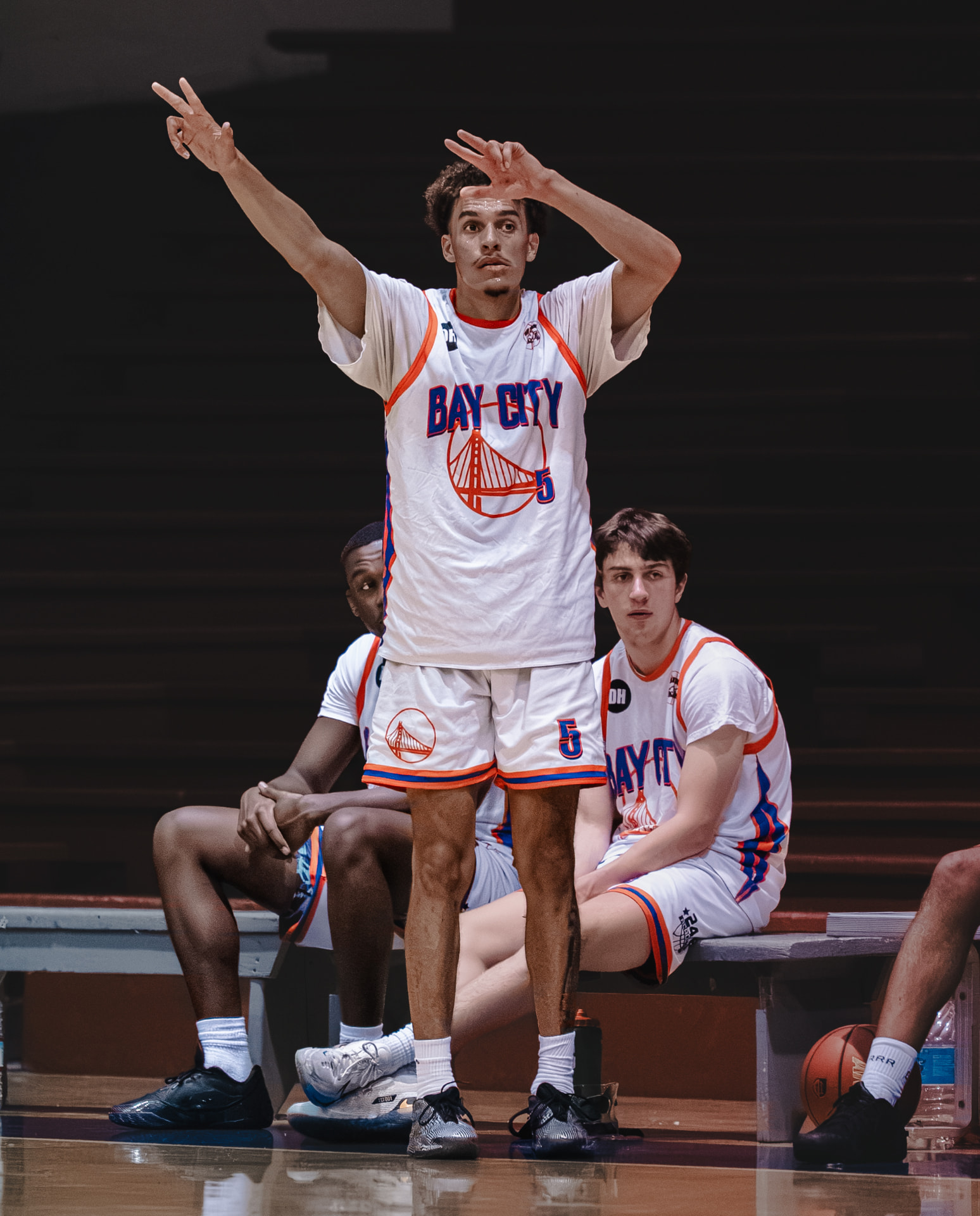 Player holding the follow-through from the bench
