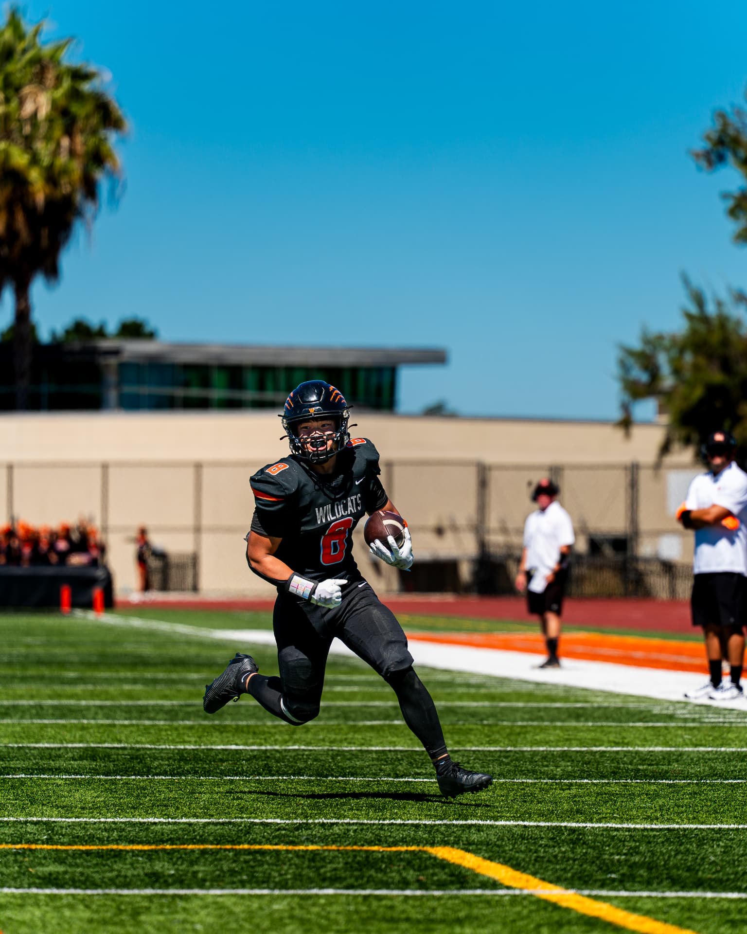 Football receiver breaking upfield with the ball